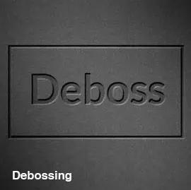 Close-up of a folder with a debossed logo — recessed impression pressed into the stock.